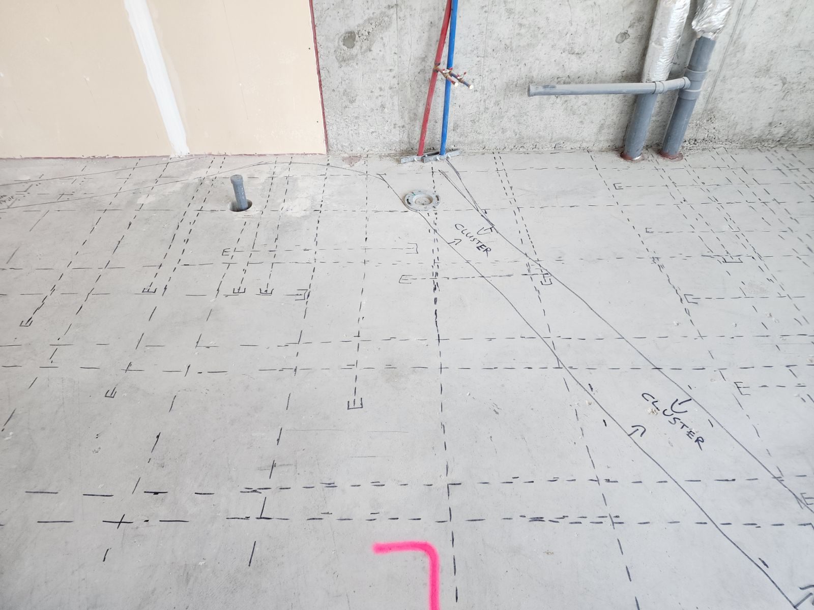 In-floor heating layout marked on a concrete slab